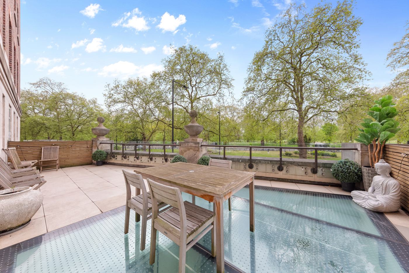 Terrace and dining area overlooking mature trees